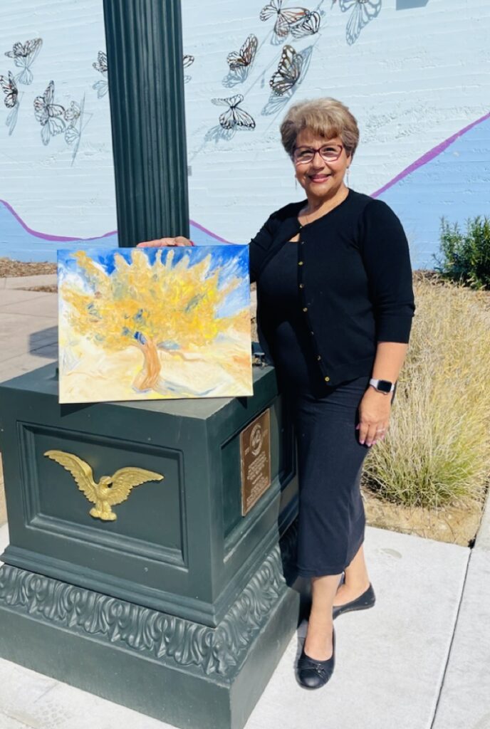 Carmen Herrera at World Bipolar Day 2025 with her painting inspired by Vincent van Gogh’s The Mulberry Tree, the artwork she featured in her painting project.